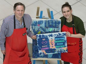DeSerres manager Thomas Baribault and artist Max K Black pose for a photo at St. Laurent Shopping Centre in Ottawa Friday. The art store has been hosting students with the Ottawa-Carleton District School Board's Specialist High Skills Major program.