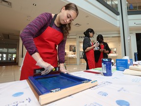 Merivale High School student Isabella McDowell works on a screen printing at the St. Laurent Shopping Centre in Ottawa on Friday. Tony Caldwell/Postmedia