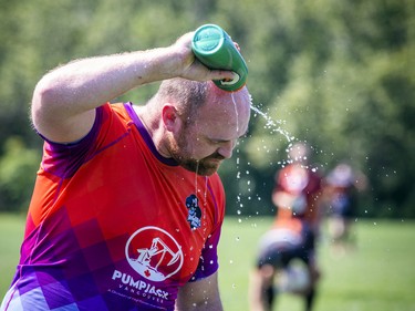 Patrick Milford of the Vancouver Rogues pours water over his head to cool off during a game Saturday.