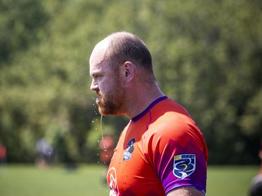 Patrick Milford of the Vancouver Rogues cools off a bit after pouring water over his head during a game Saturday.