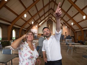 Parti Québécois Leader Paul St-Pierre Plamondon, on a campaign stop in Longueuil this week, chats with Danielle LeBlanc at a church that has been transformed into a community centre.