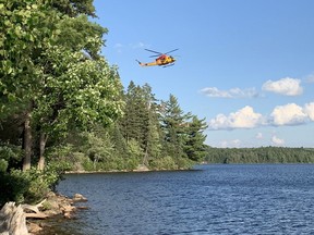 A military Bell CH-146 Griffon helicopter takes part in a rescue operation in Algonquin Park as witnessed by a National Post reporter.