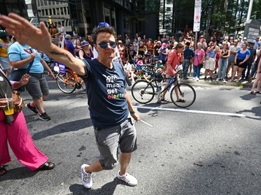 Ottawa mayoral candidate and Somerset Ward Coun. Catherine McKenney engages with participants of the 2022 Capital Pride Parade in Ottawa on Sunday, Aug. 28, 2022.