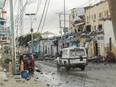 An ambulance drives past a section of Hotel Hayat, the scene of an al Qaeda-linked al Shabaab group militant attack in Mogadishu, Somalia August 20, 2022.