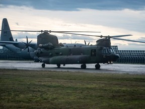 A Canadian Forces CH-147F Chinook helicopter arrives at Abbotsford International Airport, in Abbotsford, B.C., on Monday, November 22, 2021. The Department of National Defence says officials are looking into reports of engine fires on Chinook helicopters in the U.S. to determine the impact on Canada's military.