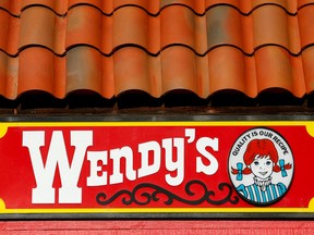 FILE PHOTO: A Wendy's sign and logo are shown at one of the company's restaurants
