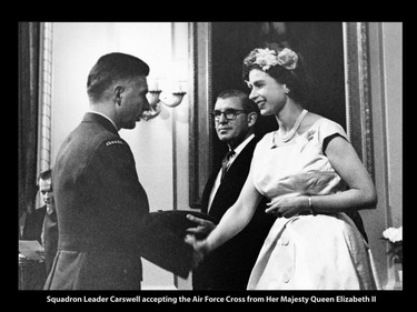 Squadron Leader A.G. Carswell receives the Air Force Cross from Queen Elizabeth II in a ceremony at Government House in Ottawa on Dominion Day, July 1st, 1959.
