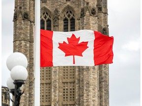Files- The Canadian flag on Parliament Hill at half mast.