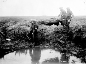 Wounded Canadians on the way to an aid-post during the Battle of Passchendaele, November 1917.