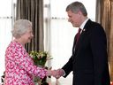 Stephen Harper, then Prime Minister, meets Queen Elizabeth at the Commonwealth Heads of Government Meeting (CHOGM) in Trinidad in 2009. 
