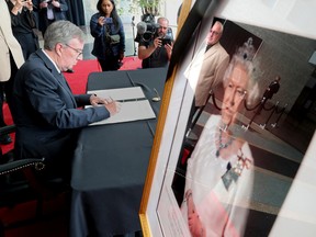 Ottawa Mayor Jim Watson is the first to sign a book of condolences to honour the passing of Queen Elizabeth II at City Hall.