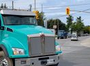 Heavy truck traffic in the heart of Manotick where Bridge Street and Manotick Main Street intersect.