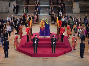 Queen Elizabeth II 's casket lies in state last week at the Palace of Westminster. Her funeral is today.