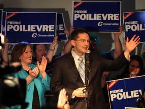 In this 2011 file photo, then-Nepean-Carleton incumbent Pierre Poilievre addresses supporters after his re-election on May 2 (he is now MP for Carleton). Beside him is Lisa MacLeod, then MPP for Nepean-Carleton (now Nepean).