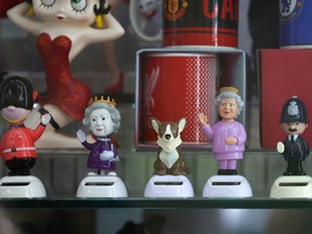 WINDSOR, ENGLAND - SEPTEMBER 09: Queen Elizabeth II souvenirs are displayed in a shop window on September 09, 2022 in Windsor, United Kingdom.