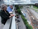 Katherine Addleman and Houston Eubank view Stage 2 LRT construction from atop their building at 1190 Richmond Road. Building residents are concerned about the noise and vibrations the new LRT line will create when it goes online. 