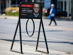 A bike rack with a photo of incumbent Kitchissippi councillor Jeff Leiper near the intersection of Richmond Road and McRae Avenue.