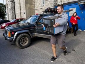 TUPOC director William Komer packs up to leave the former St. Brigid’s Church on Friday.