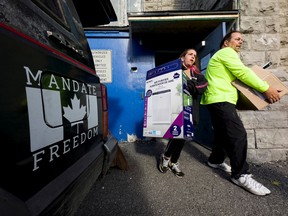 TUPOC supporters pack up to leave the former St. Brigid’s Church on Friday.