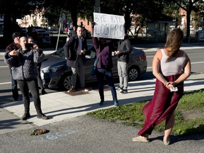 A neighbourhood resident bids farewell to TUPOC members who were court ordered to vacate the former St. Brigid’s Church on Friday.