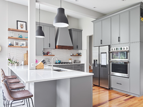 The new kitchen in this RND project now includes an oversized peninsula with breakfast bar and lots of food prep areas and storage.