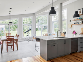 Large windows and patio door in the addition of this RND project showcase a strong indoor-outdoor connection.