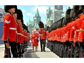 Queen Elizabeth II inspects a Guard of Honour outside the Canadian Parliament, after arriving to attend the Canada Day celebrations on July 1, 2010 in Ottawa, Canada.