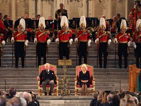 TOPSHOT - Britain's King Charles III and Britain's Camilla, Queen Consort attend the presentation of Addresses by both Houses of Parliament in Westminster Hall, inside the Palace of Westminster, central London on September 12, 2022, following the death of Queen Elizabeth II on September 8.
