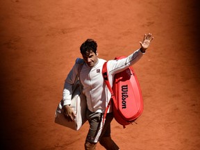 (FILES) In this file photo taken on June 7, 2019 Switzerland's Roger Federer acknowledges the audience after losing to Spain's Rafael Nadal.
