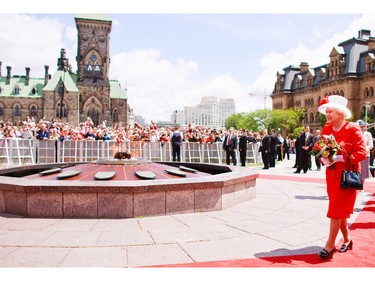Queen Elizabeth II walks past the Centennial Flame on Parliament Hill during Canada Day celebrations in Ottawa, Ontario, July 1, 2010.