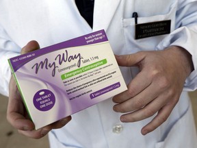 FILE - Pharmacist Simon Gorelikov holds a generic emergency contraceptive at the Health First Pharmacy in Boston on May 2, 2013. Some leaders in states that ban abortions at all points of pregnancy say exceptions for rape or incest victims aren't needed because emergency contraceptives can be used instead. But medical professionals and advocates for rape survivors say that while emergency contraception is a helpful tool, it's not always foolproof, and getting access to these emergency measures in the short timeframe in which they would be effective may not be realistic for someone who has just been assaulted.