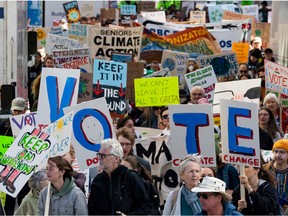 Protesters marched through downtown Ottawa on Friday demanding significant action on climate change.