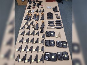 Ontario Provincial Police have seized 46 firearms after a traffic stop was executed on Highway 401 west of Prescott.