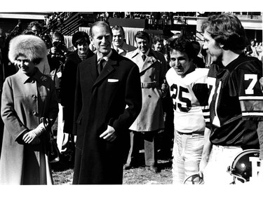 Gerry Organ of Ottawa Rough Riders (right) and Terry Evenshen of Hamilton Tiger Cats (centre, right) are introduced to Queen Elizabeth II and Prince Philip before their teams met in Canadian Football League action at Ottawa's Lansdowne Park, Oct. 15, 1979.