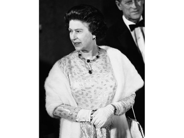 Queen Elizabeth II strikes a regal pose as she enters a Gala preformance in Ottawa, Ont., April 16, 1982 at the National Arts Centre in her honour.