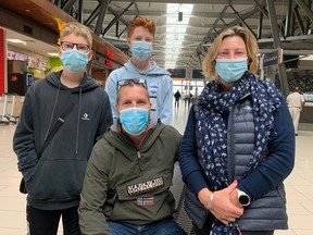 Ahead, left: Dad Chris Margates, mom Tracy Margates with their children Sammy, 13, left, and Harley, 14, at Ottawa Airport waiting for a flight to New York City.