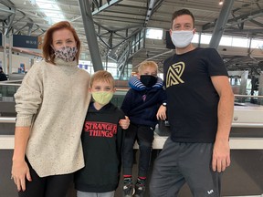 From left, mother Lauren Elliott, children Tavis, 9, Kian, 6, and father Marcus Kolback were at Ottawa Airport, waiting for a flight to Vietnam for a family vacation.