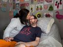 Lindsay Rodney cares her husband, Adam, at their Smiths Falls home. 
