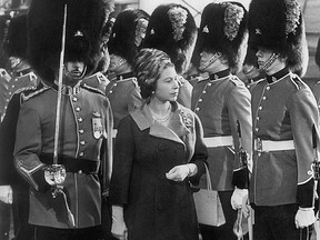 Queen Elizabeth II inspects the Royal 22nd regiment in Quebec City during a trip to Canada in 1964. Lynn Ball was working for The Canadian Press in Toronto at the time and was loaned to the Boston bureau of The Associated Press to cover that tour.