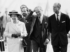 The Queen, Prime Minister Pierre Trudeau and Prince Philip walk along the pier after arriving in Vancouver in March, 1983, aboard the Royal yacht Britannia from Victoria.