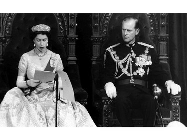Prince Philip listens attentively as the Queen reads the Speech from the Throne opening Parliament in Ottawa on Oct. 14, 1957.