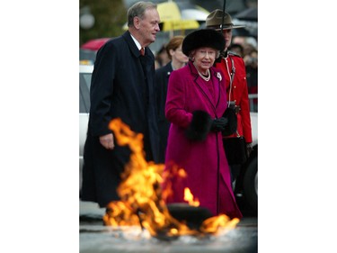 Queen Elizabeth II and Canadian Prime Minister Jean Chretien arrive on Parliament Hill for an interfaith service, in Ottawa Sunday Oct. 13, 2002.
