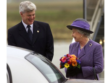 Queen Elizabeth is all smiles as she is greeted on her arrival in Ottawa yesterday by Deputy Prime Minister John Manley  - a noted anti-monarchist.