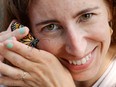 University of Ottawa researcher Heather Kharouba poses with a monarch butterfly at Carleton University on Thursday.