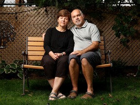 Nathalie Bourgeois and Mike Hendrigan pose for a photo outside their home in Ottawa Monday. Their dog Chico was snatched and killed by a coyote shortly after midnight on Saturday night as they were sitting around a fire with neighbours.