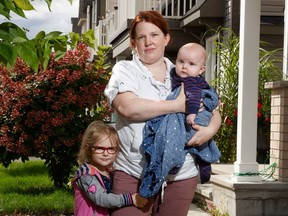 Melanie Raymond with her kids Alice, almost four, and four-month-old Billy, outside her home in Ottawa. Raymond has had a lot of trouble finding pain medication for her kids due to the shortage.
