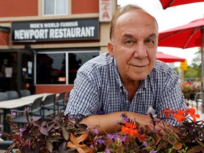 Moe Atallah poses for a photo in front of his restaurant  in Ottawa Tuesday. Moe and others in Ottawa are having problems with wasps.