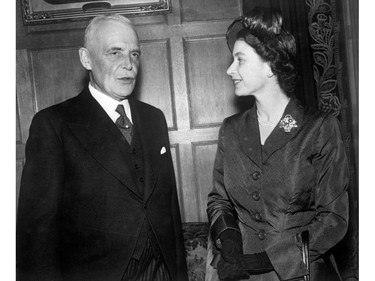 Princess Elizabeth with Canadian Prime Minister Louis St. Laurent, in the Speaker's Chambers of the Parliament Buildings in Ottawa.