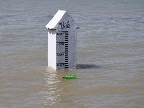 A gauge shows the water level, following rains and floods during the monsoon season in Manchar Lake, Bhan Syedabad, Pakistan, September 3, 2022.
