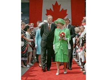 Queen Elizabeth and Prime Minister Jean Chretien make their way through a crowd of supporters following Canada Day ceremonies in Ottawa.